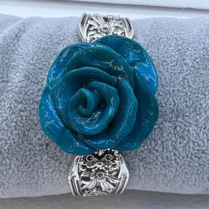 Handmade teal polymer clay rose