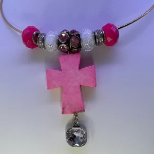 Pink cross necklace on gold plated wire - closeup