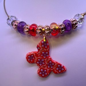 Floral patterned orange butterfly necklace