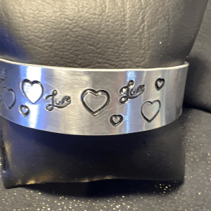 Silver plated metal stamped bracelet with love and words